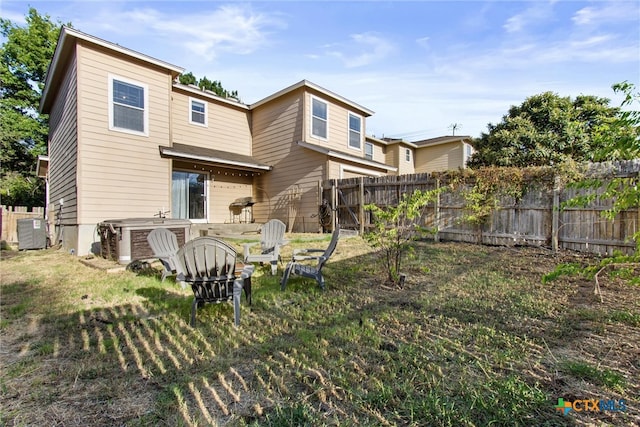 rear view of house with cooling unit