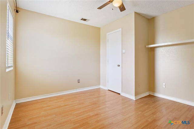 4409 Beach Ball Dr, Killeen, TX 76549 - empty room featuring light wood-type flooring, ceiling fan, baseboards, and a textured ceiling