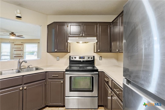 4409 Beach Ball Dr, Killeen, TX 76549 - kitchen featuring appliances with stainless steel finishes, under cabinet range hood, a sink, a ceiling fan, and light countertops