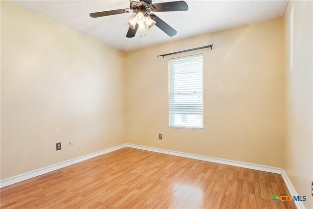 4409 Beach Ball Dr, Killeen, TX 76549 - unfurnished room featuring light wood-type flooring, baseboards, a ceiling fan, and a textured ceiling