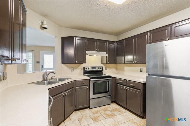 4409 Beach Ball Dr, Killeen, TX 76549 - kitchen featuring stainless steel appliances, a sink, under cabinet range hood, light countertops, and a textured ceiling