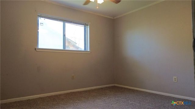 spare room featuring carpet, baseboards, a ceiling fan, and ornamental molding