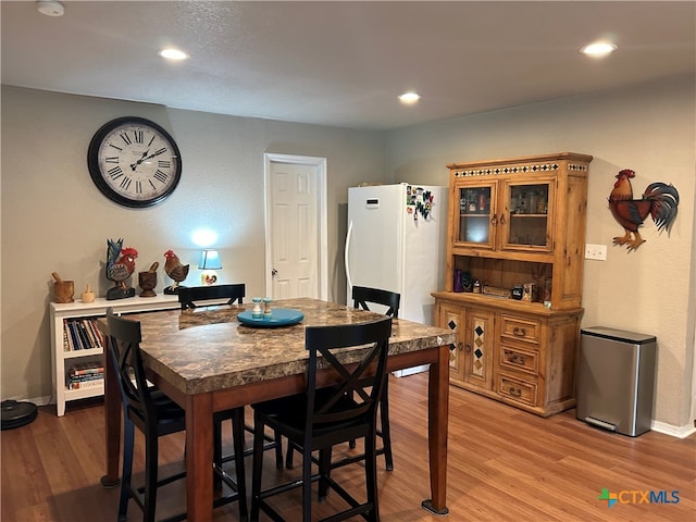 dining area with light wood-type flooring