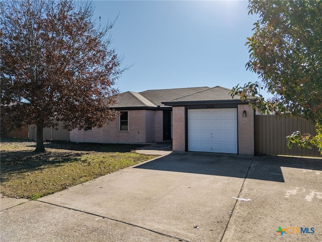 single story home with a garage