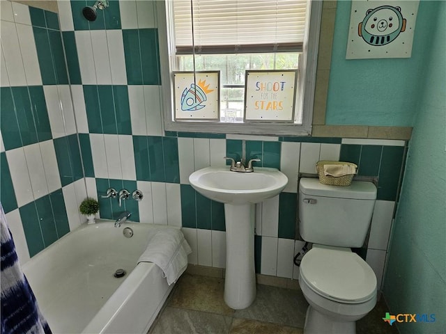 703 Atkinson Ave, Killeen, TX 76541 - full bath featuring a bath and tile walls