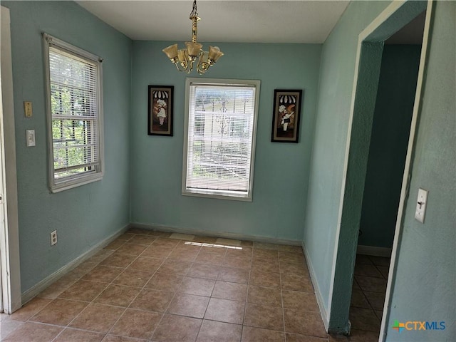 703 Atkinson Ave, Killeen, TX 76541 - unfurnished dining area with a chandelier and tile patterned floors
