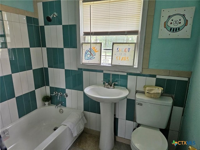 703 Atkinson Ave, Killeen, TX 76541 - full bath with a bathtub and tile walls