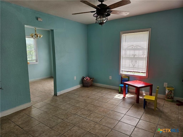 703 Atkinson Ave, Killeen, TX 76541 - empty room with tile patterned flooring, a chandelier, and ceiling fan