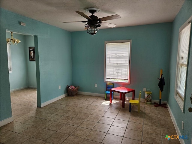 703 Atkinson Ave, Killeen, TX 76541 - dining space with a textured ceiling, a chandelier, and ceiling fan