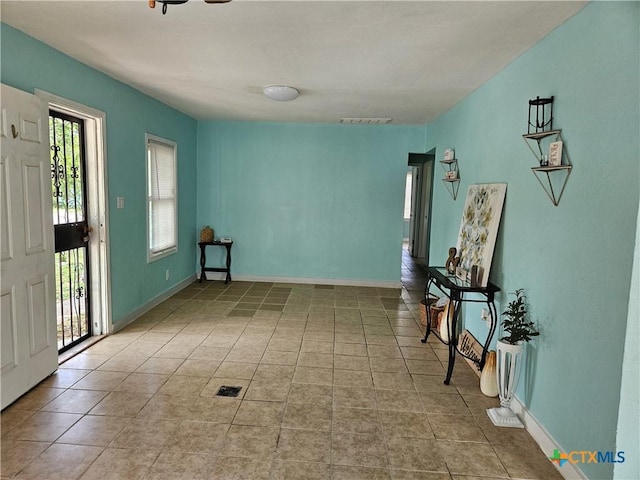 703 Atkinson Ave, Killeen, TX 76541 - empty room featuring tile patterned flooring and baseboards