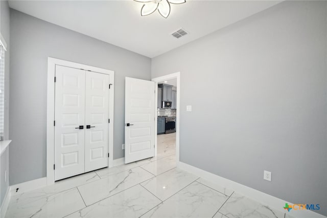 unfurnished bedroom featuring a closet