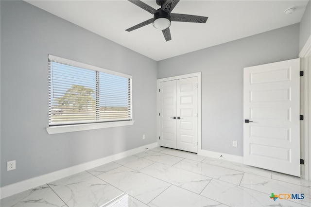 unfurnished bedroom featuring a closet and ceiling fan