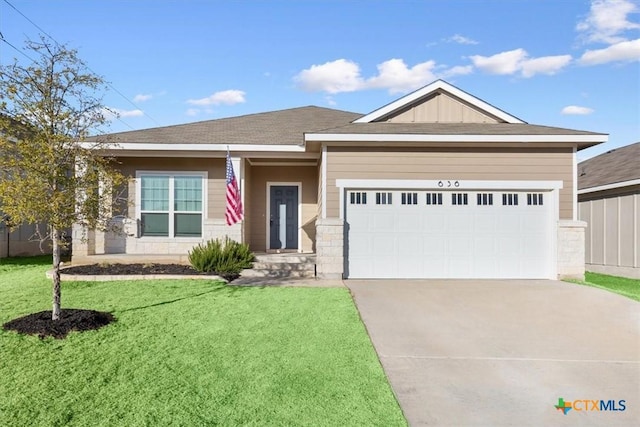 view of front facade featuring a garage and a front yard