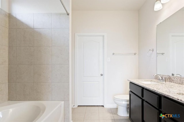 full bathroom with washtub / shower combination, toilet, vanity, and tile patterned flooring