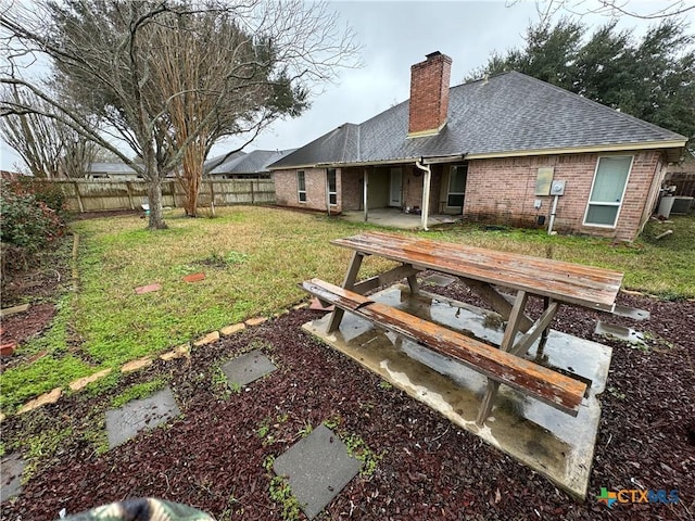 view of yard with fence and a patio