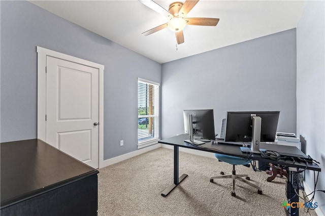 home office with baseboards, ceiling fan, and carpet floors