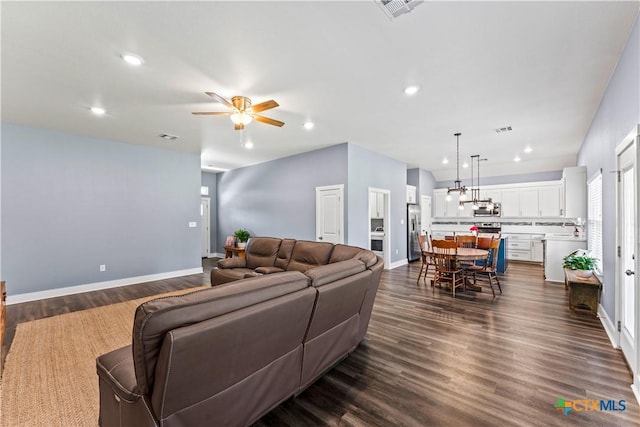 living area featuring dark wood-type flooring, recessed lighting, a ceiling fan, and visible vents