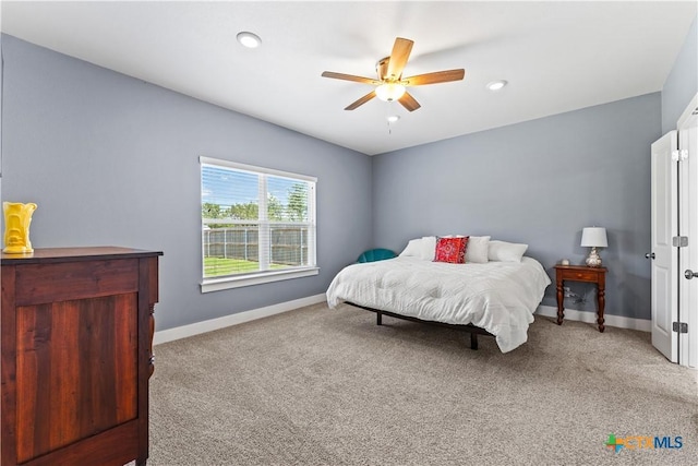 carpeted bedroom with recessed lighting, baseboards, and ceiling fan