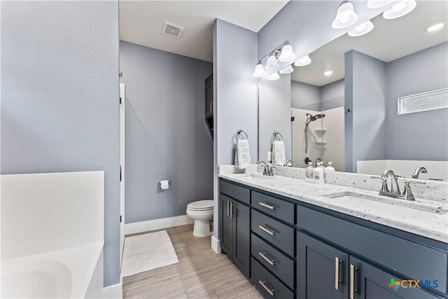 bathroom featuring a sink, visible vents, a garden tub, and a shower stall