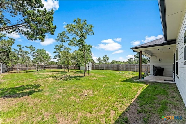 view of yard featuring a patio area and a fenced backyard