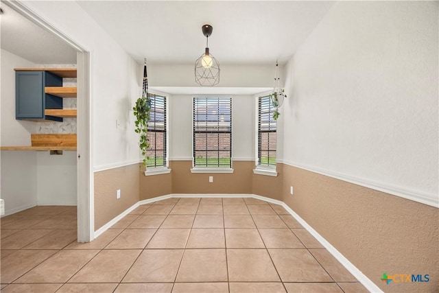 4408 Frontier Trl, Killeen, TX 76542 - unfurnished dining area with light tile patterned floors and baseboards