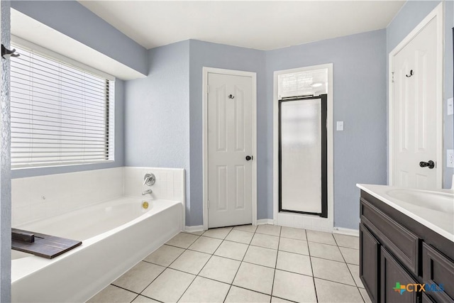 4408 Frontier Trl, Killeen, TX 76542 - bathroom featuring a bath, tile patterned floors, a stall shower, and vanity