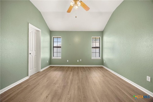 4408 Frontier Trl, Killeen, TX 76542 - spare room featuring vaulted ceiling, wood finished floors, ceiling fan, and a textured wall