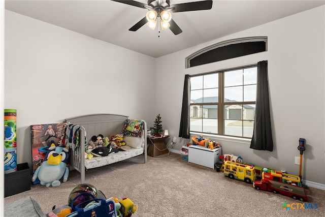 carpeted bedroom with multiple windows and ceiling fan