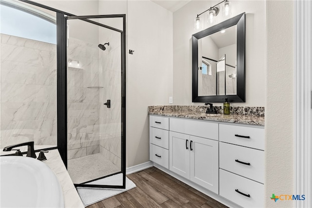 bathroom featuring plus walk in shower and vanity