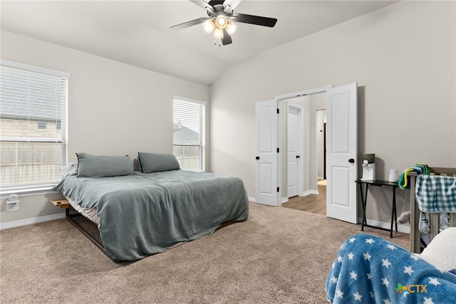 bedroom featuring carpet flooring, ceiling fan, and vaulted ceiling