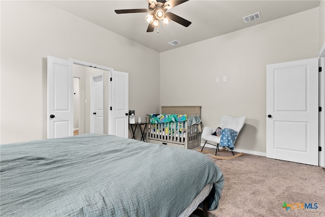 bedroom featuring ceiling fan and carpet