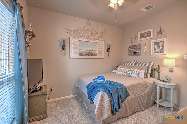 bedroom with light carpet and ceiling fan