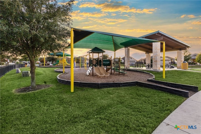 playground at dusk with a yard