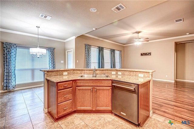 kitchen featuring dishwasher, a center island with sink, light hardwood / wood-style floors, and sink