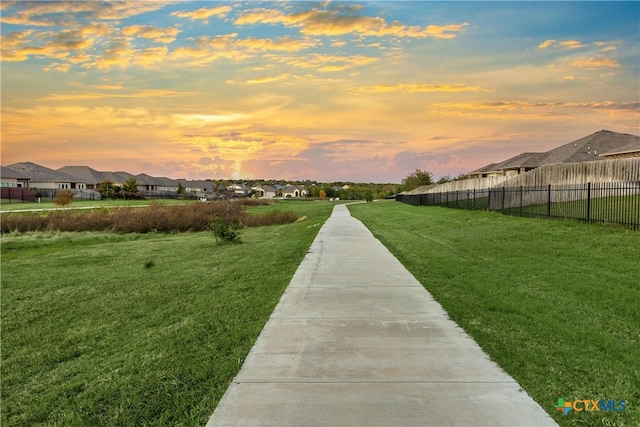 view of property's community with a lawn