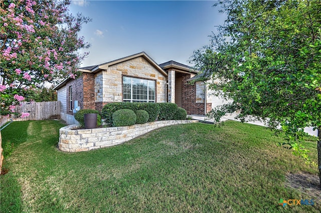 view of front of house with a front lawn