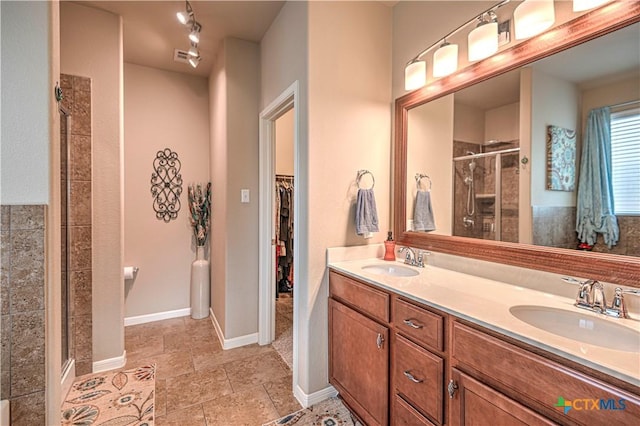 bathroom with vanity and walk in shower