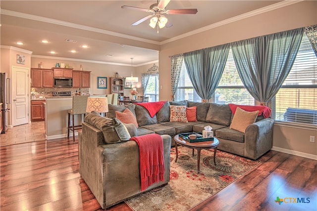 living room with ceiling fan, dark wood-type flooring, and ornamental molding