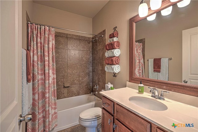 full bathroom with shower / bath combination with curtain, vanity, and toilet