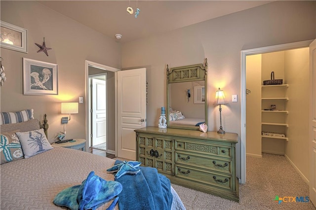 bedroom featuring light colored carpet