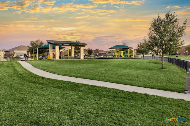 view of home's community featuring a gazebo, a yard, and a playground