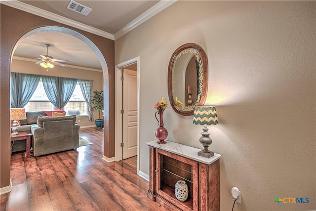 hall with dark hardwood / wood-style floors and crown molding