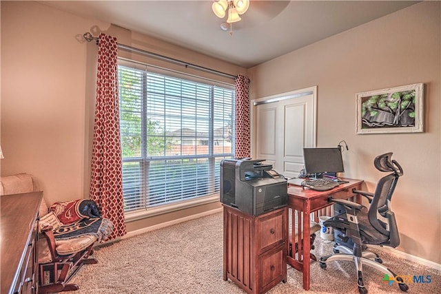 office area featuring ceiling fan and light colored carpet