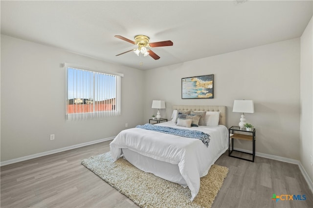 bedroom featuring ceiling fan and light wood-type flooring