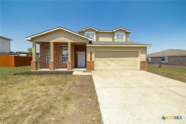 view of front of house featuring a garage and a front yard