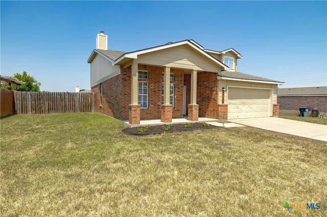 view of front of home featuring a front yard and a garage