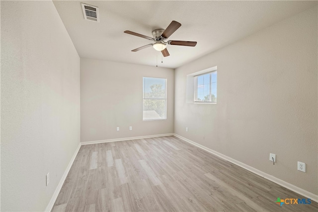 unfurnished room featuring ceiling fan and light wood-type flooring