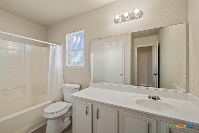 full bathroom featuring shower / tub combo with curtain, vanity, and toilet