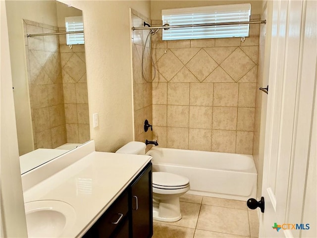 full bathroom with tiled shower / bath, vanity, toilet, and tile patterned flooring