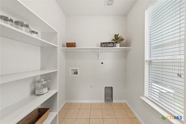 laundry room with washer hookup, light tile patterned flooring, and hookup for an electric dryer